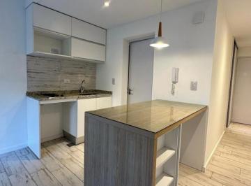 Mueble de cocina completo con barra desayunadora. · Venta/permuta - Monoambiente - Pileta y Quincho - Bella Vista, Rosario.