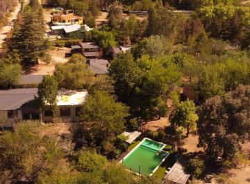Departamento · 1250m² · 6 Ambientes · 5 Cocheras · Complejo Turístico en Tanti – 8 Cabañas + Spa + Río – 11.800