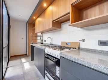 Departamento · 56m² · 3 Ambientes · Venta | Permuta - Dúplex de 1 Dormitorio con Patio - Sarmiento, Rosario. Apto Crédito.