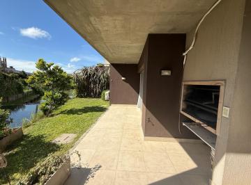 Departamento · 64m² · 3 Ambientes · 1 Cochera · Venta con Renta Oportunidad Pb con Jardín en Lago Escondido 3 Amb Al Agua