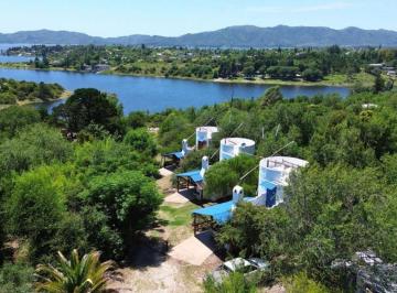 ¿Busca un negocio consolidado en un entorno natural inigualable?
Presentamos una · ¡Oportunidad! 3 Cabañas + Vivienda con Costa de Lago - Cab0032
