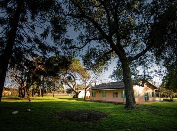 Campo · 246m² · 8 Ambientes · Campo en Venta de 2has con Dos Propiedades Amobladas en Colonia Suiza, Baradero. Ideal Inversión.