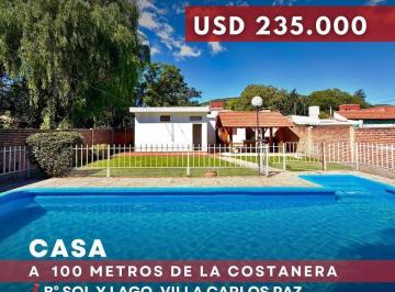Casa · 219m² · 7 Ambientes · 1 Cochera · Exclusiva Casa en Venta 3 Dorm. con Pileta en Barrio Sol y Lago - Villa Carlos Paz