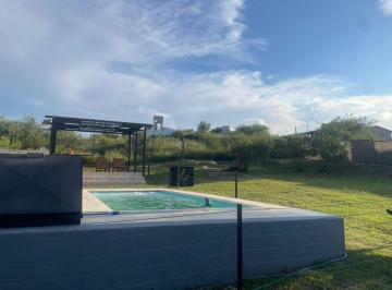 Casa · 120m² · 2 Ambientes · 2 Cocheras · En Venta Casa con Domótica y Gran Parque en Villa Carlos Paz