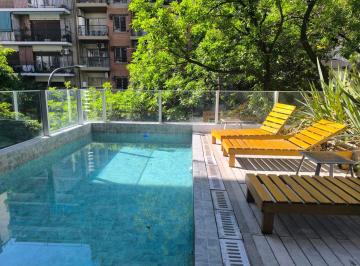 Pileta y solarium · Departamento 3 Dorm. en Duplex + Terraza Privada con Parrilla y Quincho