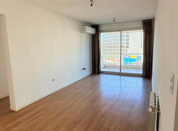 Living comedor con aa.cc y cortinas · Excelente Departamento con Ammenities, 2 Ambientes, Cochera Techada, Seguridad