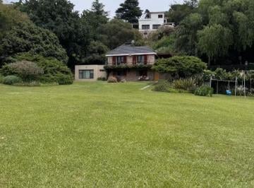 Casa de 7 ambientes, Villa Carlos Paz · Casa Frente Al Lago con Pileta y Parque de 5.000 m² – Villa Carlos Paz – 14 Personas