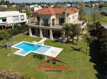 Casa · 334m² · 6 Ambientes · 6 Cocheras · Casa en Venta y Alquiler con Vista a La Laguna Frente y Fondo en Terravista. 6 Ambientes!